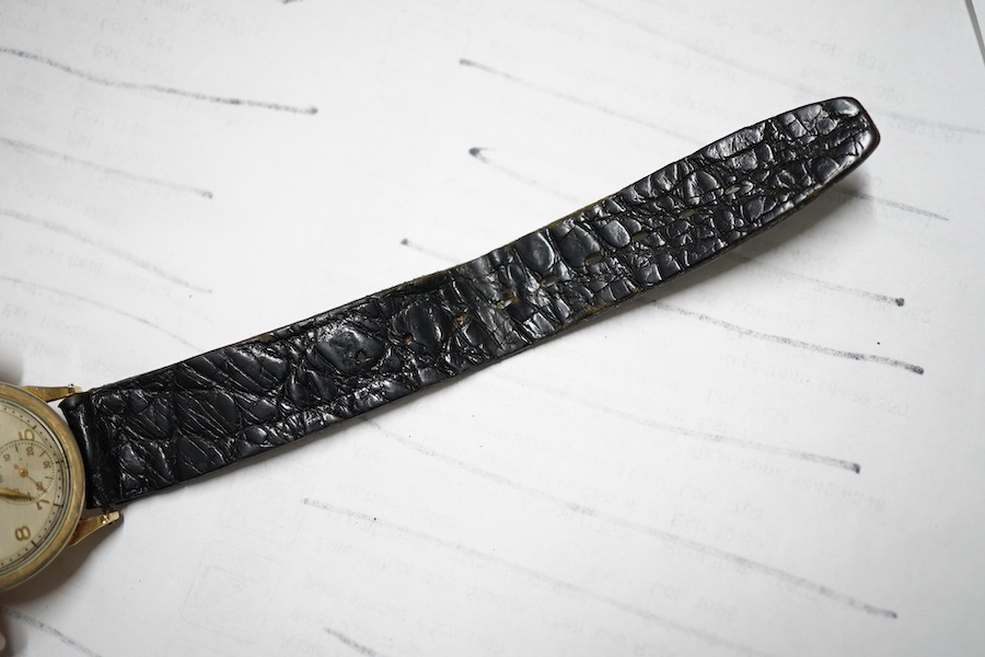 A boy's size 1940's 10k gold filled Longines manual wind wrist watch, with Arabic dial and subsidiary seconds cased and timed in the U.S.A., case diameter 28mm, movement c.10L, on an associated leather strap.